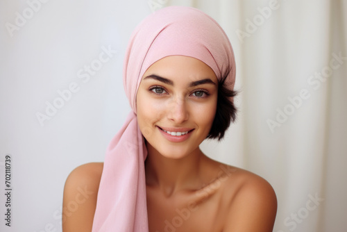 Wallpaper Mural Smiling woman with pink headscarf. Concept of cancer awareness Torontodigital.ca
