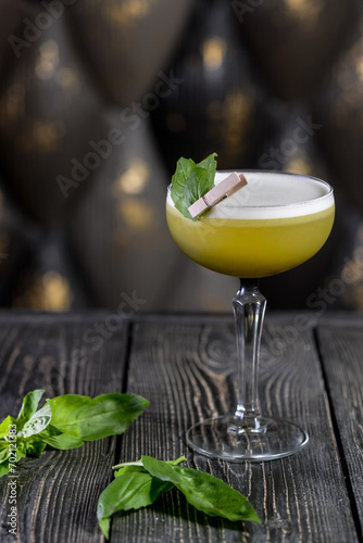 green cocktail on a wooden board