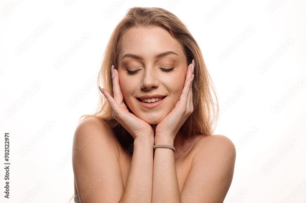 Beauty portrait of young beautiful blonde girl smiling on isolated white background. Skin care concept Beauty portrait of young beautiful blonde girl smiling on isolated white background. Skin care concept
