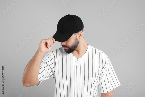 Photography Man in stylish black baseball cap on light grey background