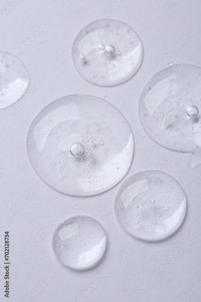 Samples of cosmetic serum on white background, above view Samples of cosmetic serum on white background, above view