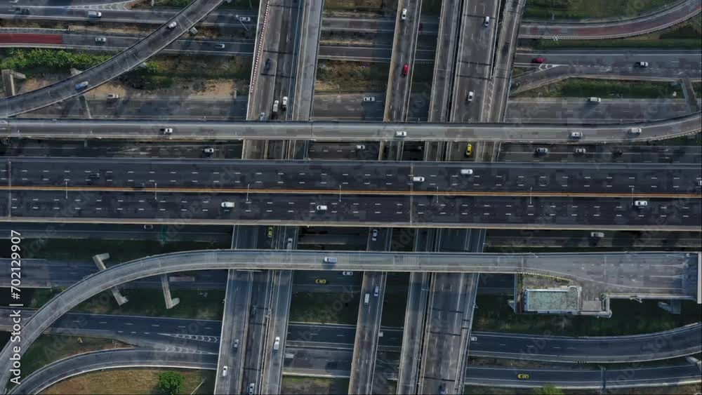 Time lapse aerial view of Expressway top view, Road traffic an important infrastructure in Thailand. Road and Roundabout, multilevel junction motorway Time lapse aerial view of Expressway top view, Road traffic an important infrastructure in Thailand. Road and Roundabout, multilevel junction motorway