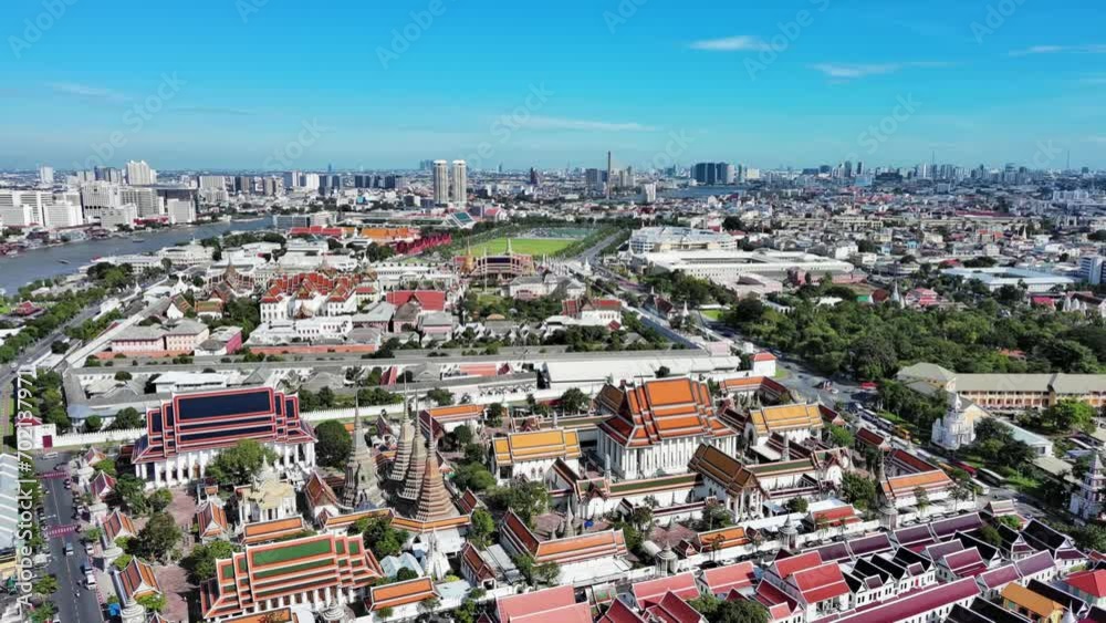 Bangkok, Thailand: Aerial view of Wat Pho temple complex (Temple of the Reclining Buddha) in heart of Thai capital city, Grand Palace on horizon - landscape panorama of Southeast Asia from above Bangkok, Thailand: Aerial view of Wat Pho temple complex (Temple of the Reclining Buddha) in heart of Thai capital city, Grand Palace on horizon - landscape panorama of Southeast Asia from above