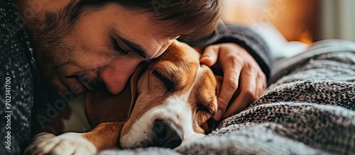 boy and faithful beagle sharing a loving embrace in a charming snapshot Picture perfect moment of a dog lover cuddling with his furry companion radiating happiness. with copy space image photo