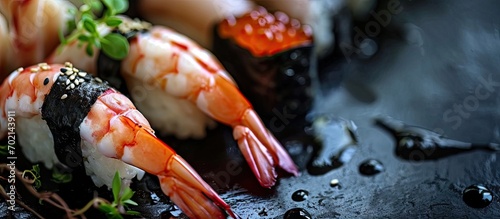 Black tiger prawn sushi topped with seafood. with copy space image. Place for adding text or design © vxnaghiyev