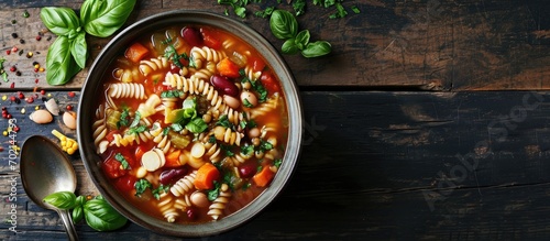 Bowl of Minestrone Soup with Pasta Beans and Vegetables. with copy space image. Place for adding text or design