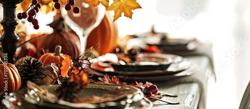 Autumn Thanksgiving Friendsgiving family gathering dinner table setting Flat lay of Fall table with tableware cutlery decorated with vegetables leaves and fruits over plain white background
