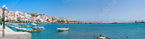 Sea bay with moored boats. Promenade in Mediterranean town Sitia, Crete © Dasha Petrenko