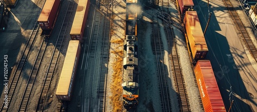 An Aerial View of a Steam Locomotive Moving Freight Cars Around in a Freight Yard to Organize a Freight Train on a Sunny Day. with copy space image. Place for adding text or design photo