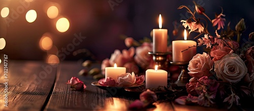 Candlelight decor near table for couple on Valentine s day Luxury romantic date Decoration flowers decor candles Location for surprise marriage proposal. with copy space image © vxnaghiyev