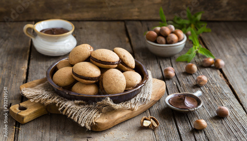 Baci di dama italian hazelnut biscuits cookies with chocolate cream, rustic style