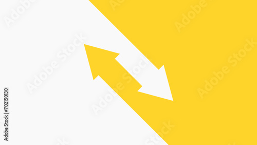 Two arrows pointing in opposite directions diagonally. Yellow and white background.  photo