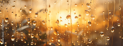 Golden Reflections: Raindrops on a Window Pane