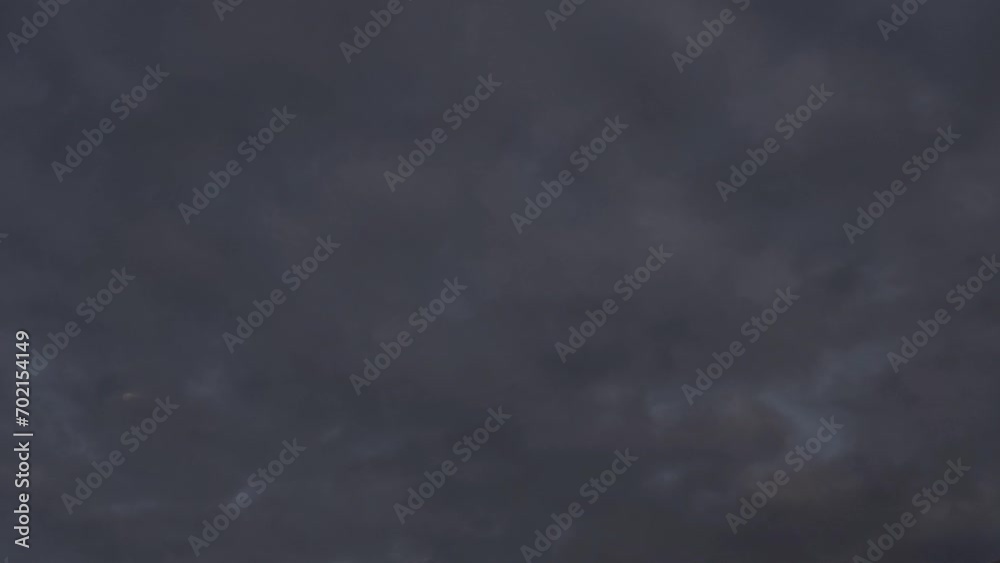 Sky full of altocumulus clouds cover the beautiful moon at dawn Sky full of altocumulus clouds cover the beautiful moon at dawn