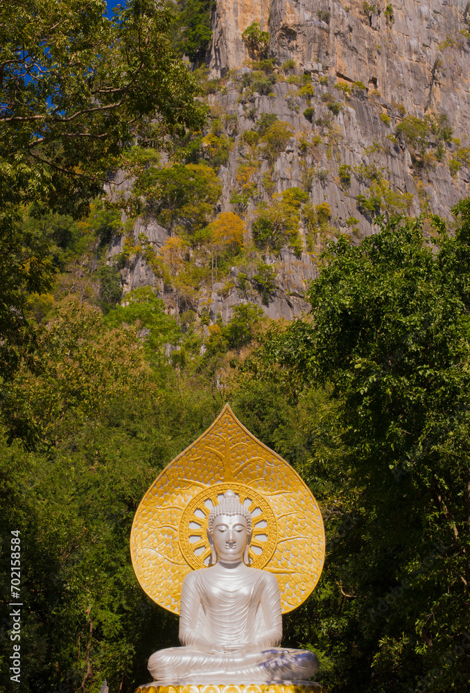 Picture of golden buddha statue in outdoor natural place