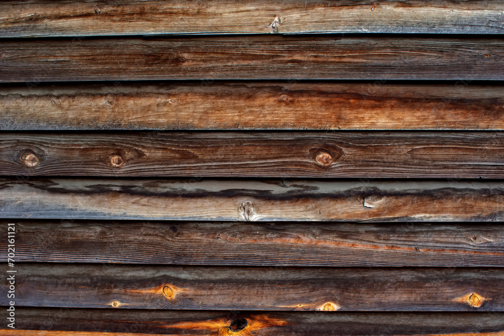 Fototapeta premium Dark brown vintage wooden background.