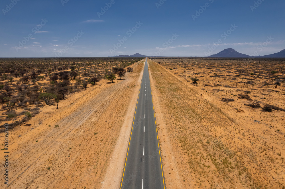 Aerial drone shot of straight and empty road from Namibia, Africa. Aerial drone shot of straight and empty road from Namibia, Africa.