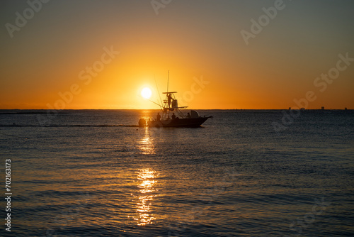 fishing boat at sunset © Eagle