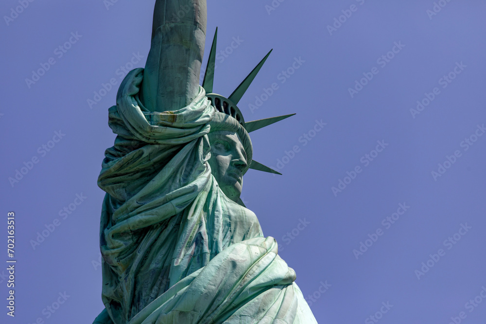 Fototapeta premium Incredible photo of the Statue of Liberty with its crown is the democratic symbol of New York (USA) and the Big Apple.