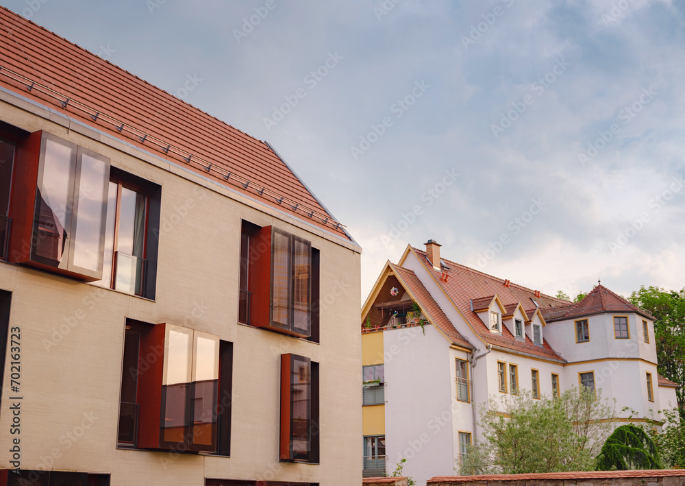 spring trip to Europe. Travel and German sightseeing locations. scenic view to facade of old historic houses somewhere in Erfurt city, Traditional half-timbered houses makes cozy and fairy tail mood