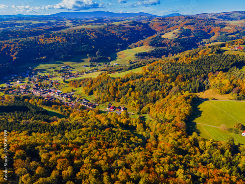 Fall colors in Austrian Burgenland. Beautiful forest aerial view. Landscape with beautiful sky and nature.