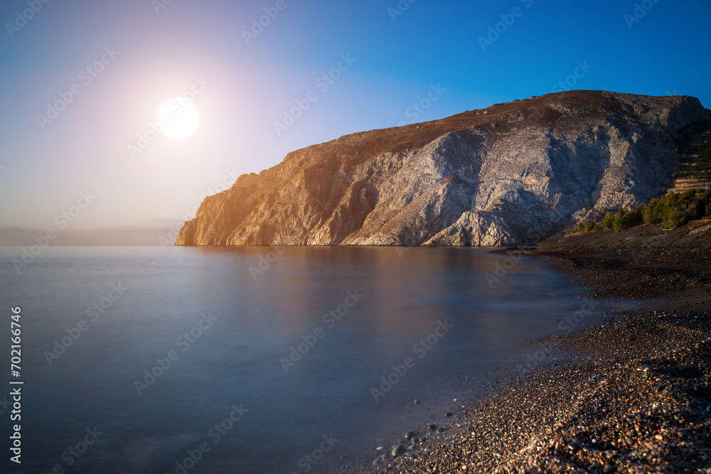 Tranquil dawn on a peaceful sandy beach with calm water. Tranquil dawn on a peaceful sandy beach with calm water.