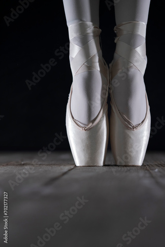Fotografie detail of female ballet dancer's foot in ballet position with pointe shoe in fro