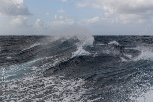 Beautiful seascape - waves and sky with clouds with beautiful lighting. Stormy sea, Bad weather. Gale. Rough sea. Beaufort scale 6.