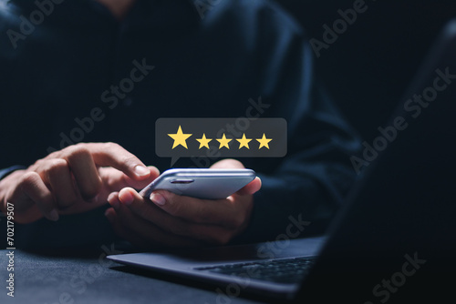 Customer satisfaction service concept. Businessman rate 5-star satisfaction on online application. satisfaction feedback review, good quality most.