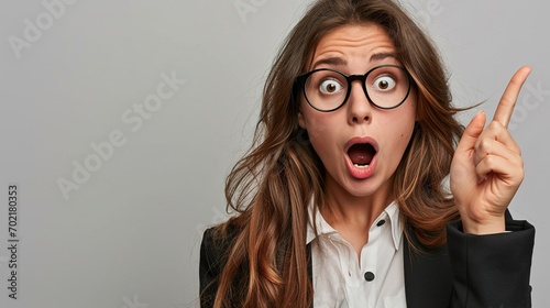 Shocked woman, portrait and pointing on mockup for announcement, advertising or marketing. Surprised business female point finger to copy space in shock for advertisement against a studio background 