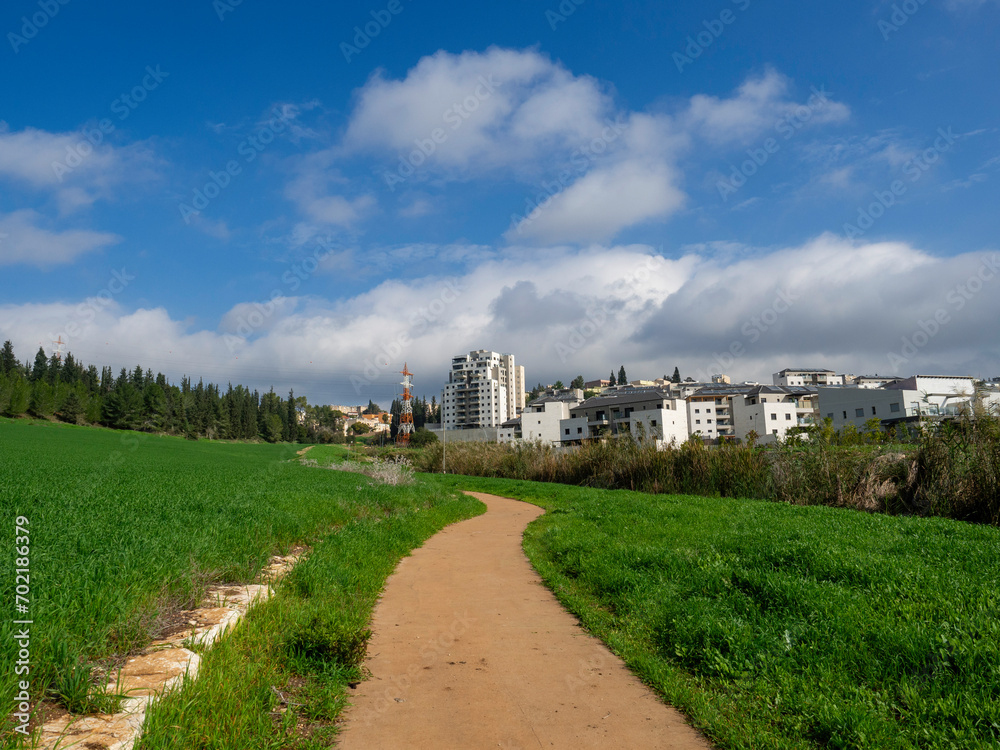 landscape with houses and trees, View of the city of Migdal Ha Emek, Migdal Haemek in northern Israel
