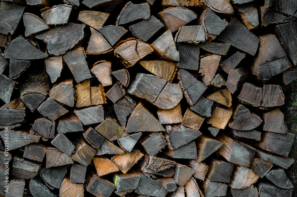 Wooden brown background. Background made of logs, tree in section. Wooden brown background. Background made of logs, tree in section.