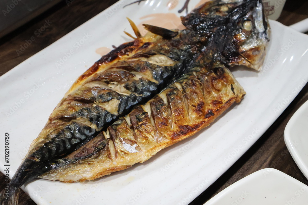 Korean food. Grilled mackerel on a plate