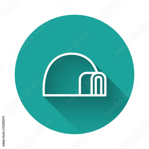 White line Igloo ice house icon isolated with long shadow. Snow home, Eskimo dome-shaped hut winter shelter, made of blocks. Green circle button. Vector