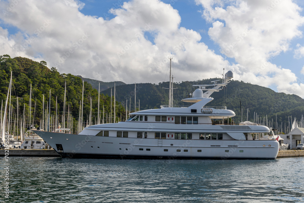 Luxury super yacht moored alongside in marina. Motor yacht. Yachting concept.