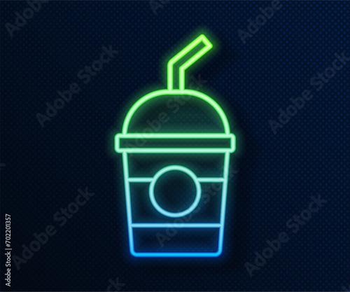 Glowing neon line Milkshake icon isolated on blue background. Plastic cup with lid and straw.  Vector