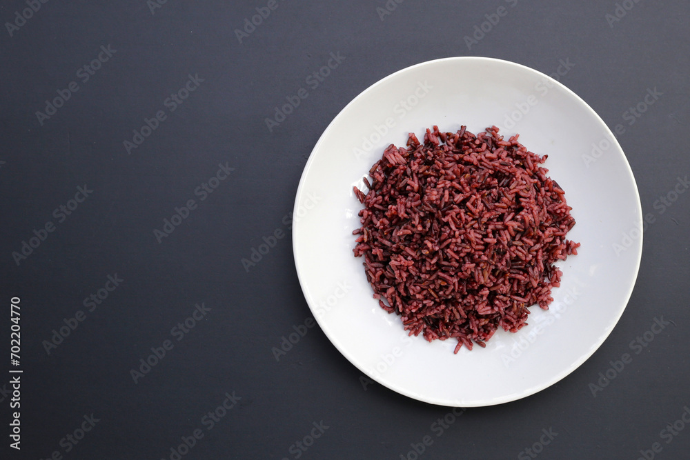 Cooked black rice on dark background. Cooked black rice on dark background.
