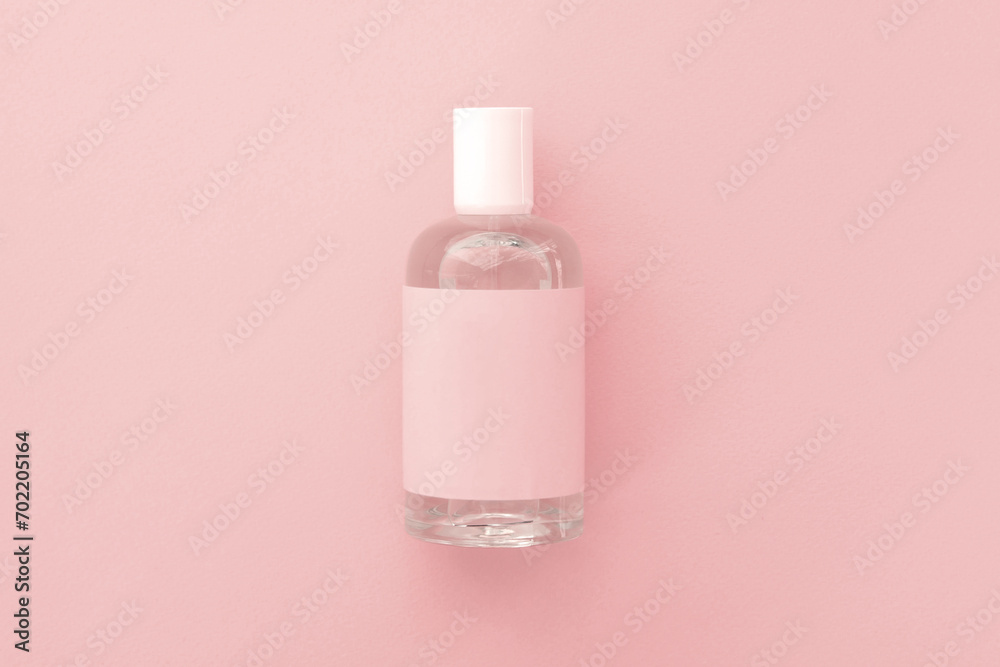one bottle of perfume against the pink background one bottle of perfume against the pink background