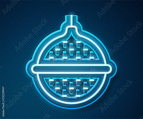 Glowing neon line Ball tea strainer icon isolated on blue background.  Vector