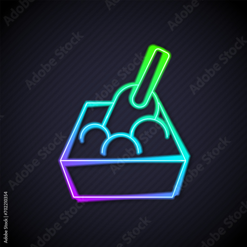 Glowing neon line Cat litter tray with shovel icon isolated on black background. Sandbox cat with shovel.  Vector