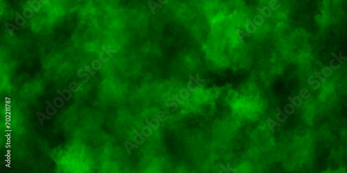 Colorful smoke on a black background,Green smoke in dark background. Blackhole Texture and desktop,abstract green background,