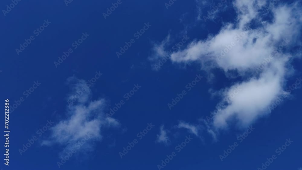 Small cumulus clouds in formation move around the corners Small cumulus clouds in formation move around the corners