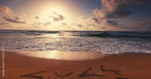 Tropical ocean beach colorful sunrise caribbean sea waves happy new year 2024 video photo