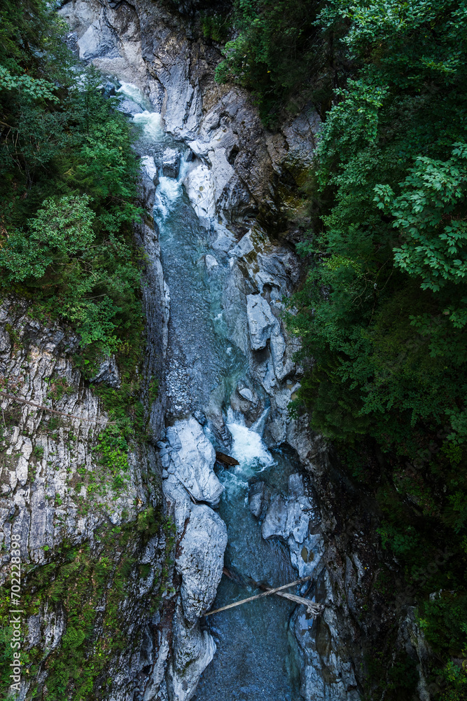 top view of wild river in green surrounding in the bavarian alps top view of wild river in green surrounding in the bavarian alps