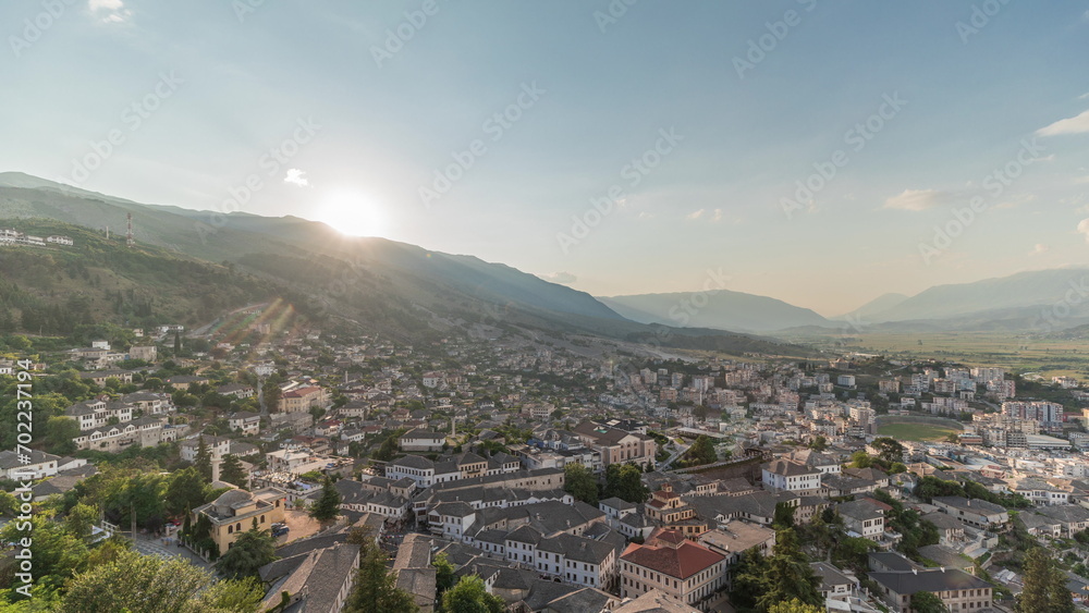 Panorama showing sunset over Gjirokastra city from the viewpoint of the fortress of the Ottoman castle of Gjirokaster timelapse.