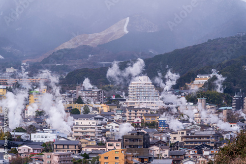 Beppu cityscape with Steam drifted from public hot spring  baths and ryokan onsen background, Beppu, Oita, Kyushu, Japan. photo