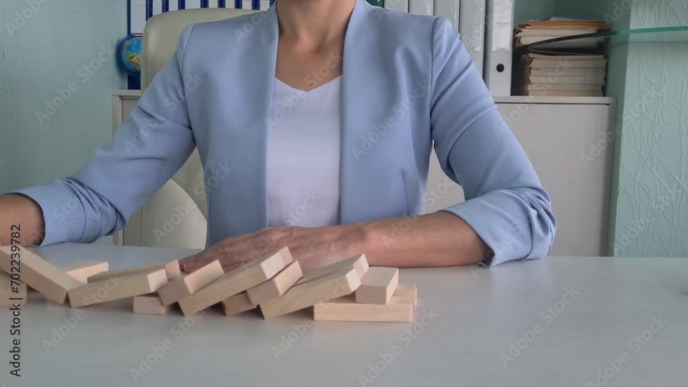 Gold coins with bitcoin logo fall on jenga market. Rollback of the cryptocurrency leader Bitcoin BTC at auction