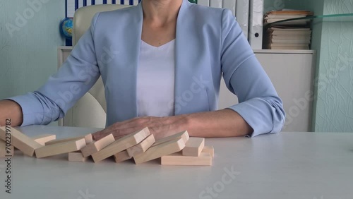 Gold coins with bitcoin logo fall on jenga market. Rollback of the cryptocurrency leader Bitcoin BTC at auction photo