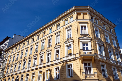 facades of historic tenement houses in the city of Poznan