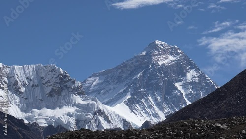 Rocky snow peak mountains in Himalayas. Highest summits world are Everest. Trekking to Everest base camp. People from all over world go to look at sherpa country. View of highest peak from Gokyo Lakes photo